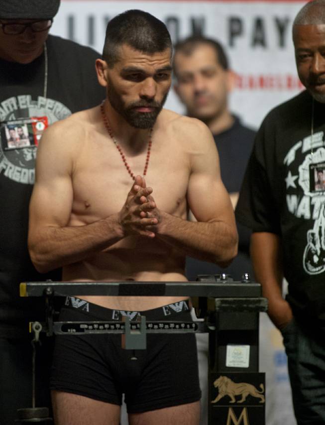 Super welterweight Alfredo "El Perro" Angulo of Mexico  stands focused during his weigh-in at the MGM Grand Arena on Friday, March 07, 2014.